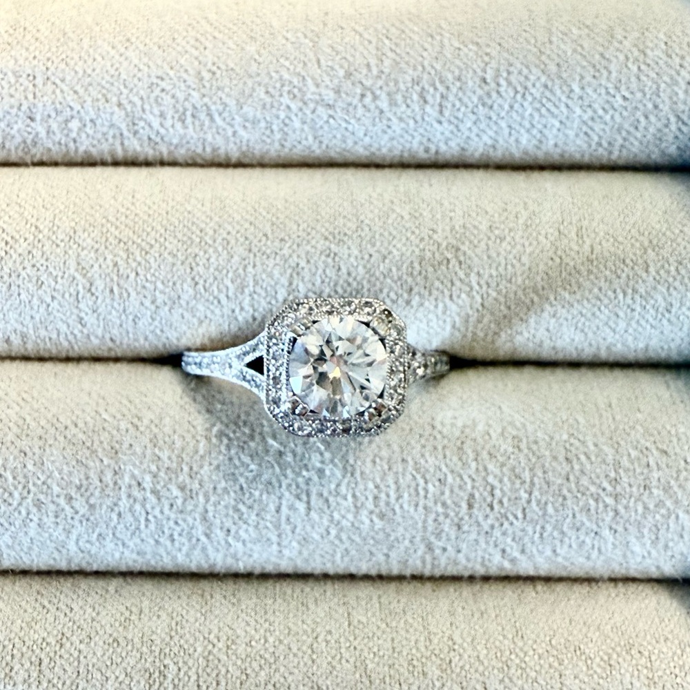 Stunning white gold 14 Karat Center one carat diamond with a Halo voyage look